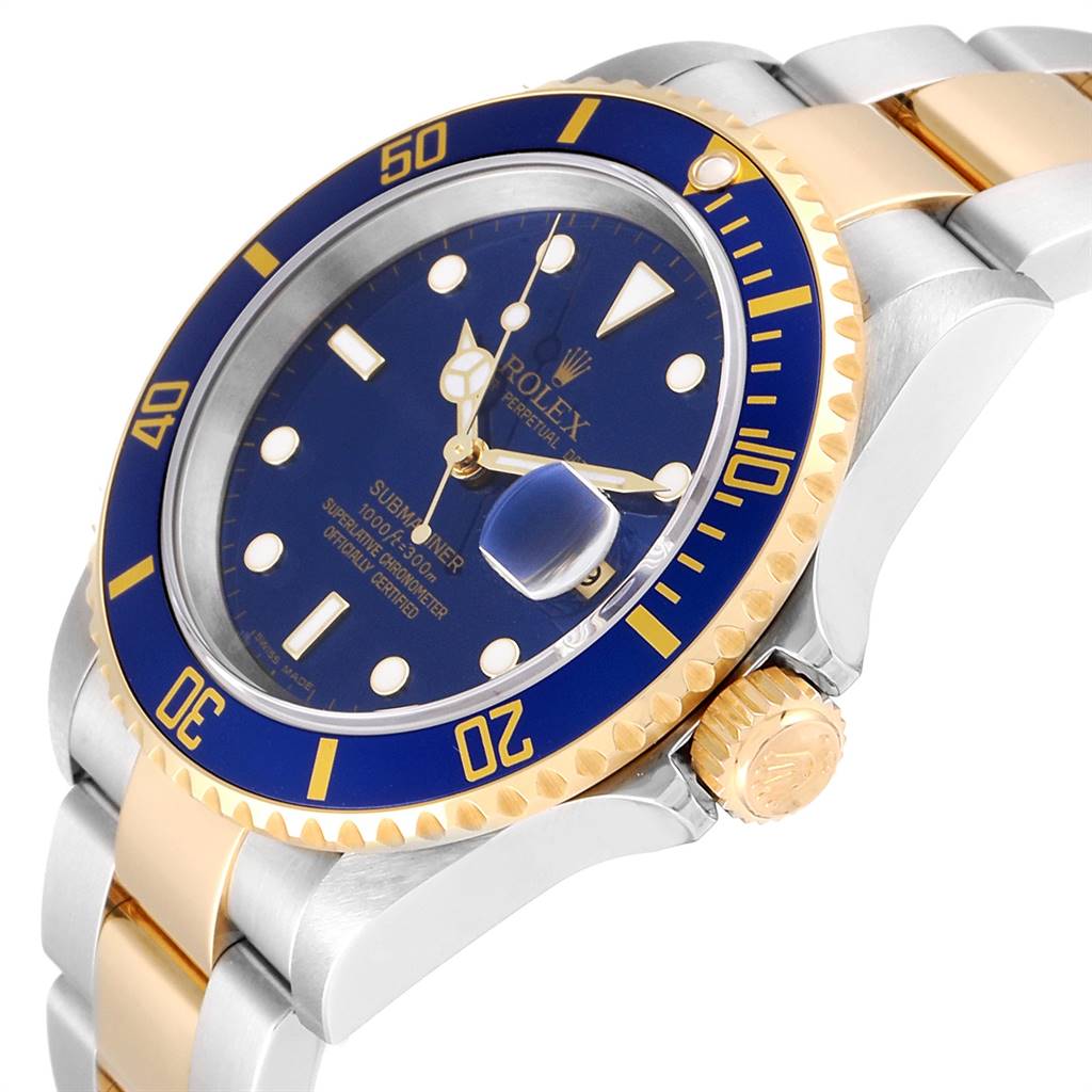 This image shows a Rolex Submariner 16613 Men
s Steel and Gold (two tone) Blue Dial 16613 Men
s Steel and Gold (two tone) Blue Dial watch angled to display its blue dial, bezel, and the two-tone bracelet.
