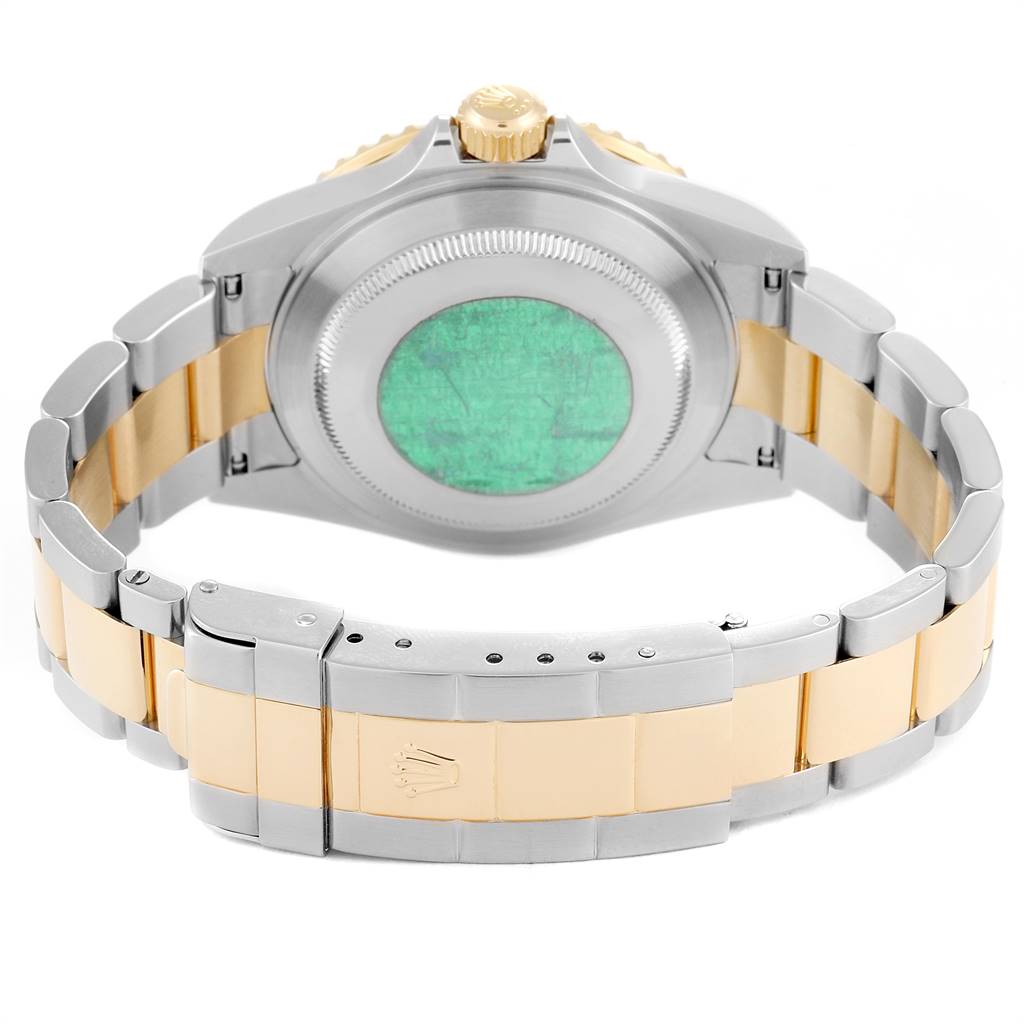 This image shows the back and bracelet of a Rolex Submariner 16613 Men
s Steel and Gold (two tone) Blue Dial 16613 Men
s Steel and Gold (two tone) Blue Dial watch, featuring a two-tone gold and silver design with a visible clasp.