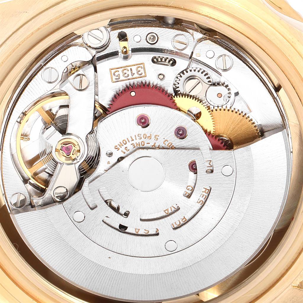 This image shows the internal mechanism of a Rolex Submariner 16618 Men's Yellow Gold Blue Dial 16618 Men's Yellow Gold Blue Dial watch, highlighting gears and intricate components.