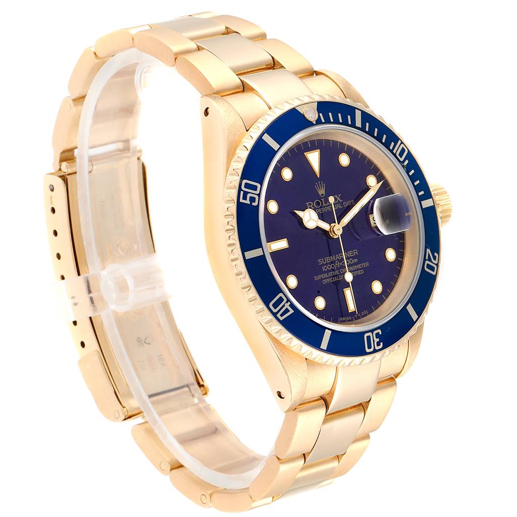 This image shows a Rolex Submariner 16618 Men's Yellow Gold Blue Dial 16618 Men's Yellow Gold Blue Dial watch at an angle displaying the face, bezel, crown, and bracelet.
