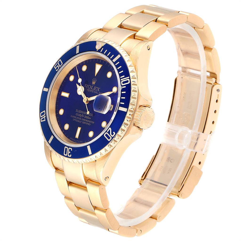 This image shows a Rolex Submariner 16618 Men's Yellow Gold Blue Dial 16618 Men's Yellow Gold Blue Dial watch at a three-quarter angle, featuring its blue dial, bezel, gold case, and bracelet.