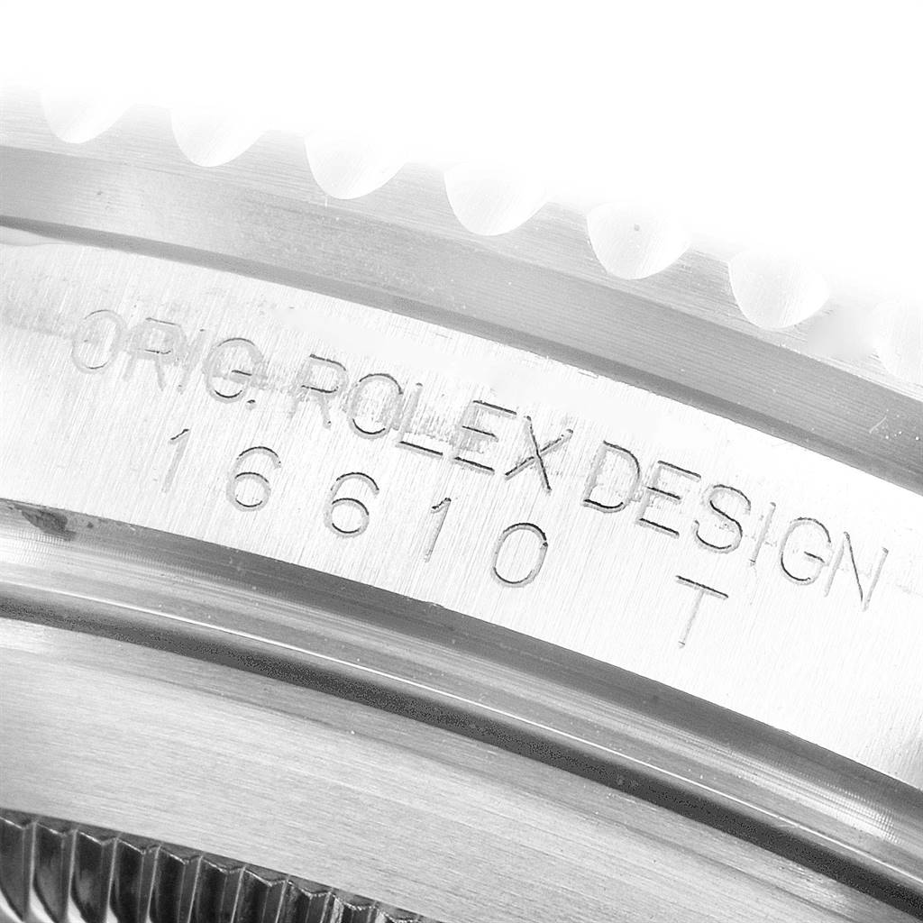 The image shows a close-up of the case with engraving details of a Rolex Submariner 16610LV Men
s Stainless Steel Black Dial 16610LV Men
s Stainless Steel Black Dial model 16610.