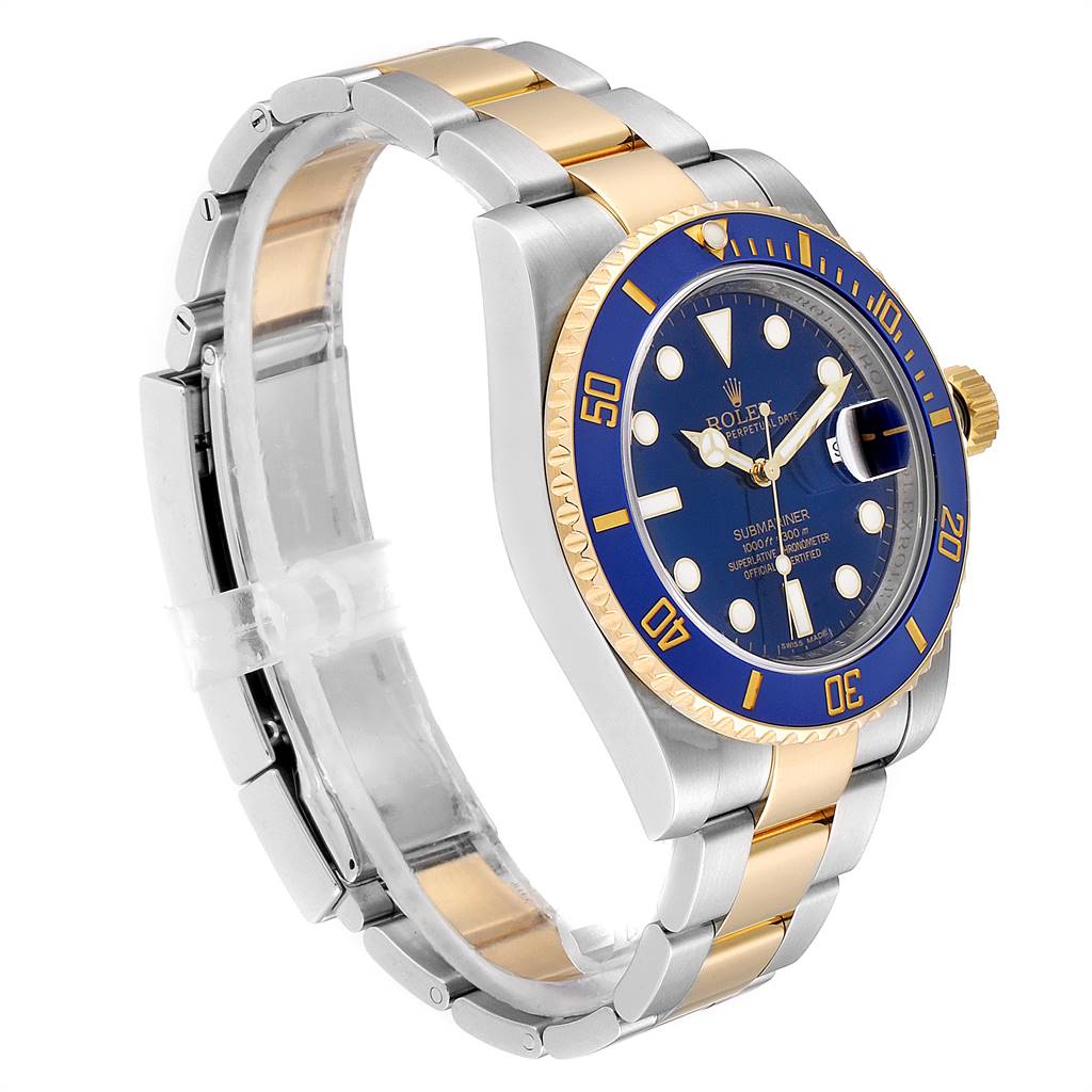 The Rolex Submariner 116613 Men
s Steel and Gold (two tone) Blue Dial 116613 Men
s Steel and Gold (two tone) Blue Dial watch is displayed at a three-quarter angle showing its blue dial, bezel, and two-tone bracelet.