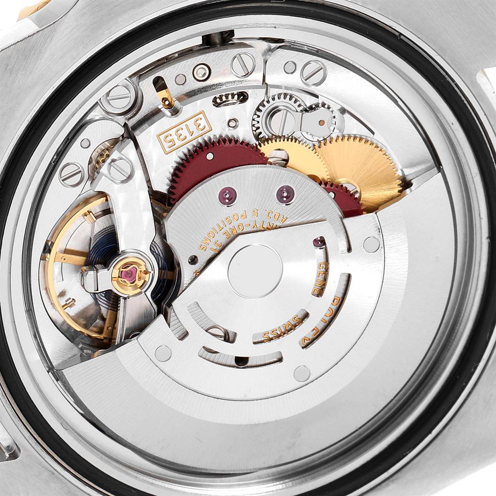 The image shows a close-up of the internal movement mechanism of a Rolex Submariner 116613 Men
s Steel and Gold (two tone) Blue Dial 116613 Men
s Steel and Gold (two tone) Blue Dial watch.