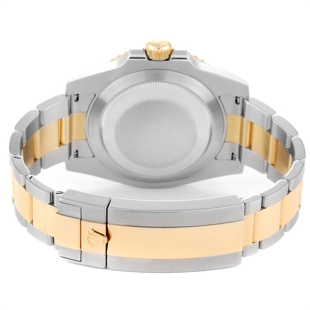 This image shows the back view of a Rolex Submariner 116613 Men
s Steel and Gold (two tone) Blue Dial 116613 Men
s Steel and Gold (two tone) Blue Dial, highlighting its clasp, bracelet, and case back.