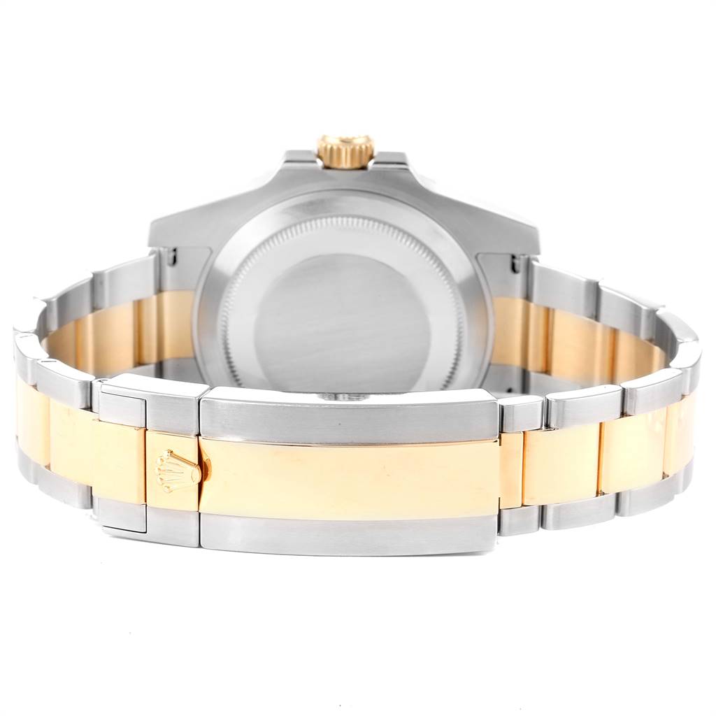 This image shows the back view of a Rolex Submariner 116613 Men
s Steel and Gold (two tone) Black Dial 116613 Men
s Steel and Gold (two tone) Black Dial watch, featuring its case back, bracelet, and clasp.