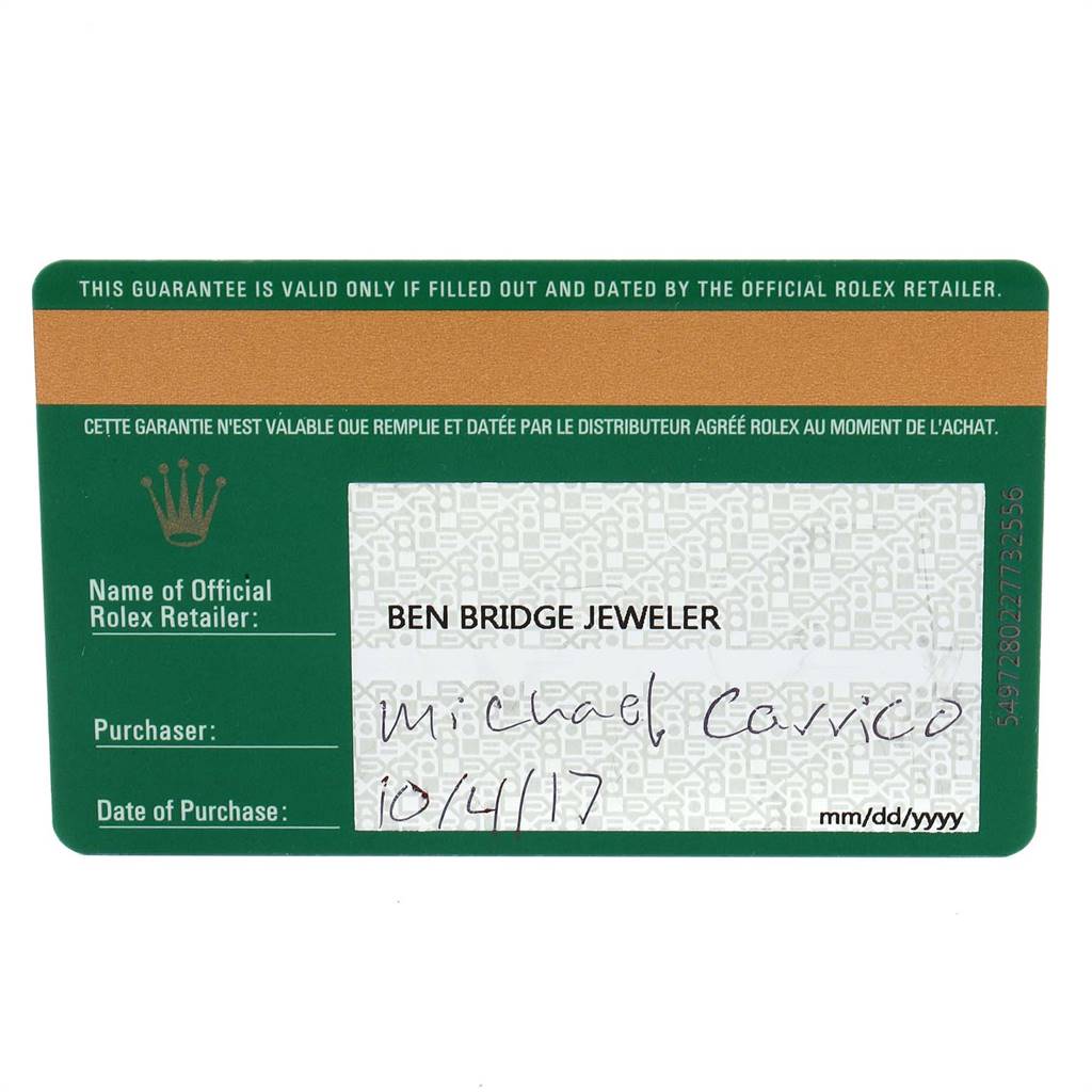 The image shows the warranty card for the Submariner model by Rolex from an overhead angle.