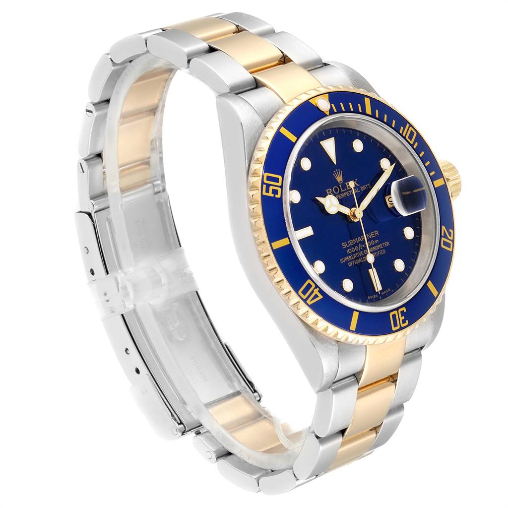 The image shows a Rolex Submariner 16613 Men
s Steel and Gold (two tone) Blue Dial 16613 Men
s Steel and Gold (two tone) Blue Dial watch at a slight angle, highlighting its blue dial, gold bezel, and two-tone bracelet.