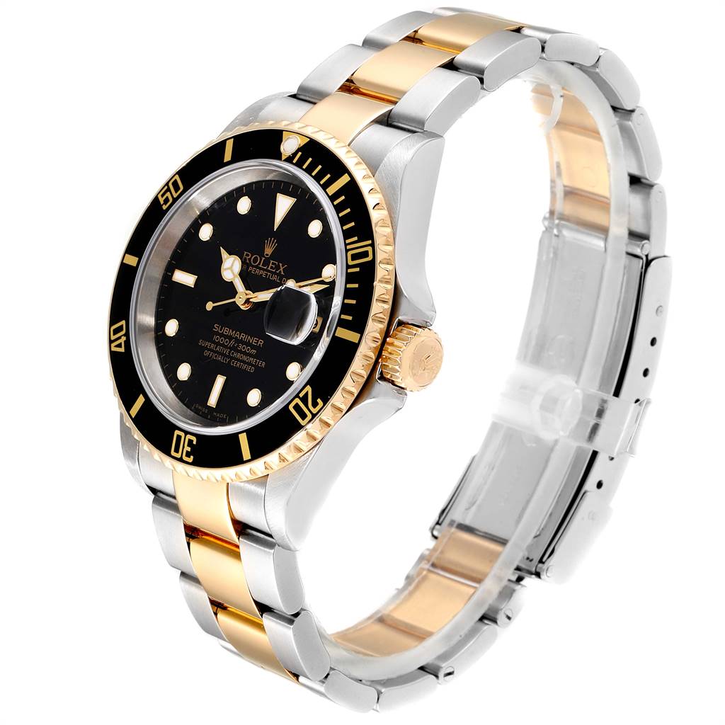 The image shows a Rolex Submariner 16613 Men's Steel and Gold (two tone) Black Dial 16613 Men's Steel and Gold (two tone) Black Dial watch angled from the top-left, highlighting its black dial, gold bezel, and two-tone bracelet.