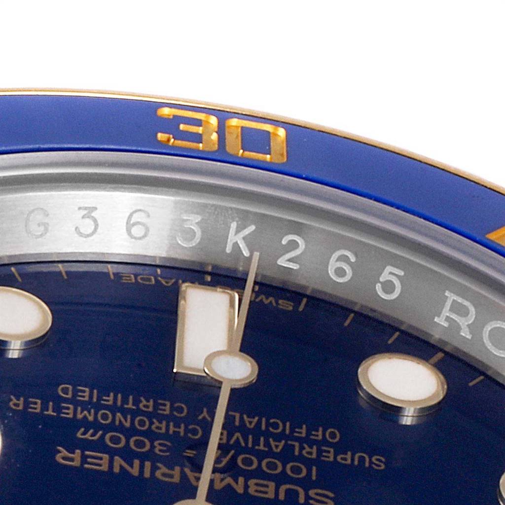 The image shows a close-up of the dial, hour marker, minute and second hands, and part of the bezel of a Rolex Submariner 116613 Men
s Steel and Gold (two tone) Blue Dial 116613 Men
s Steel and Gold (two tone) Blue Dial watch.