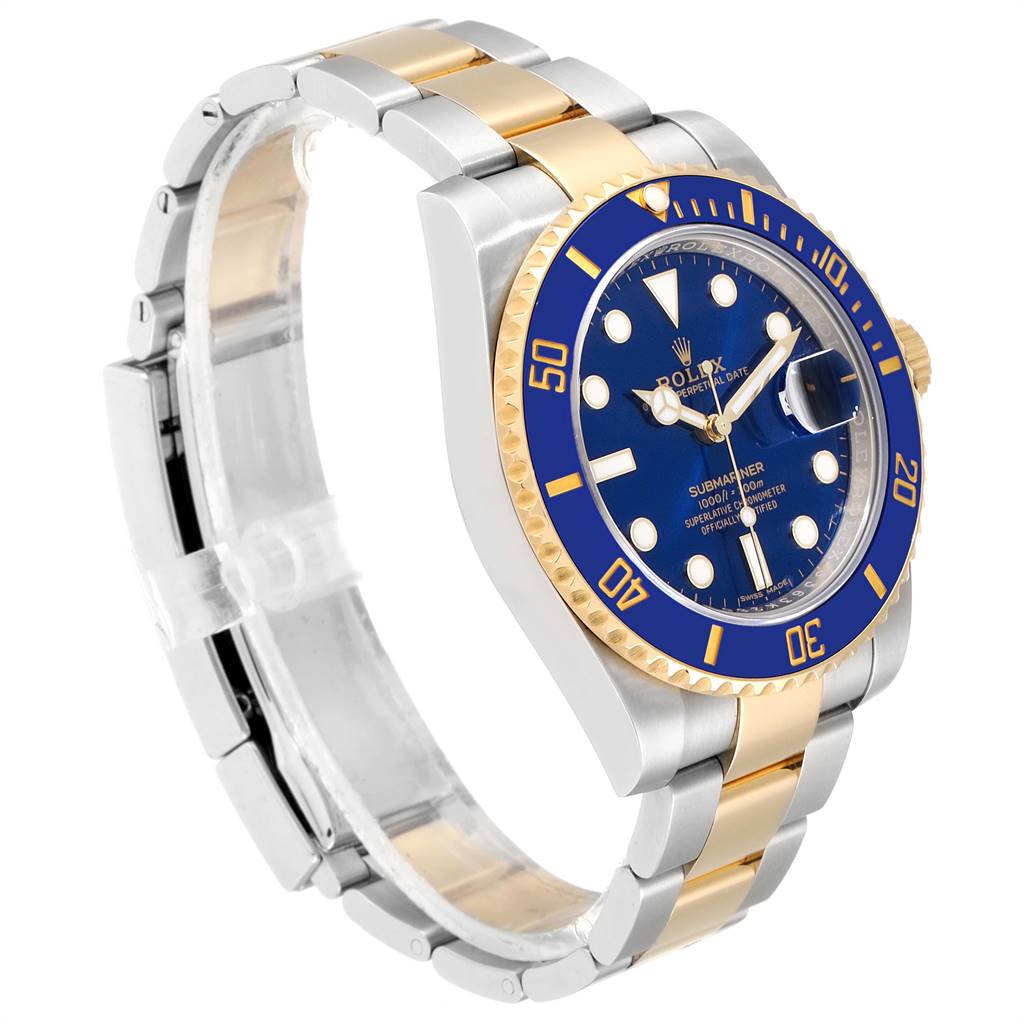 The image shows a Rolex Submariner 116613 Men
s Steel and Gold (two tone) Blue Dial 116613 Men
s Steel and Gold (two tone) Blue Dial watch from a three-quarter angle, highlighting the two-tone bracelet, blue bezel, and dial.