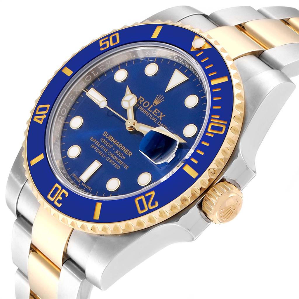 The image shows a Rolex Submariner 116613 Men
s Steel and Gold (two tone) Blue Dial 116613 Men
s Steel and Gold (two tone) Blue Dial watch at an angle highlighting the blue and gold bezel, dial, and part of the bracelet.