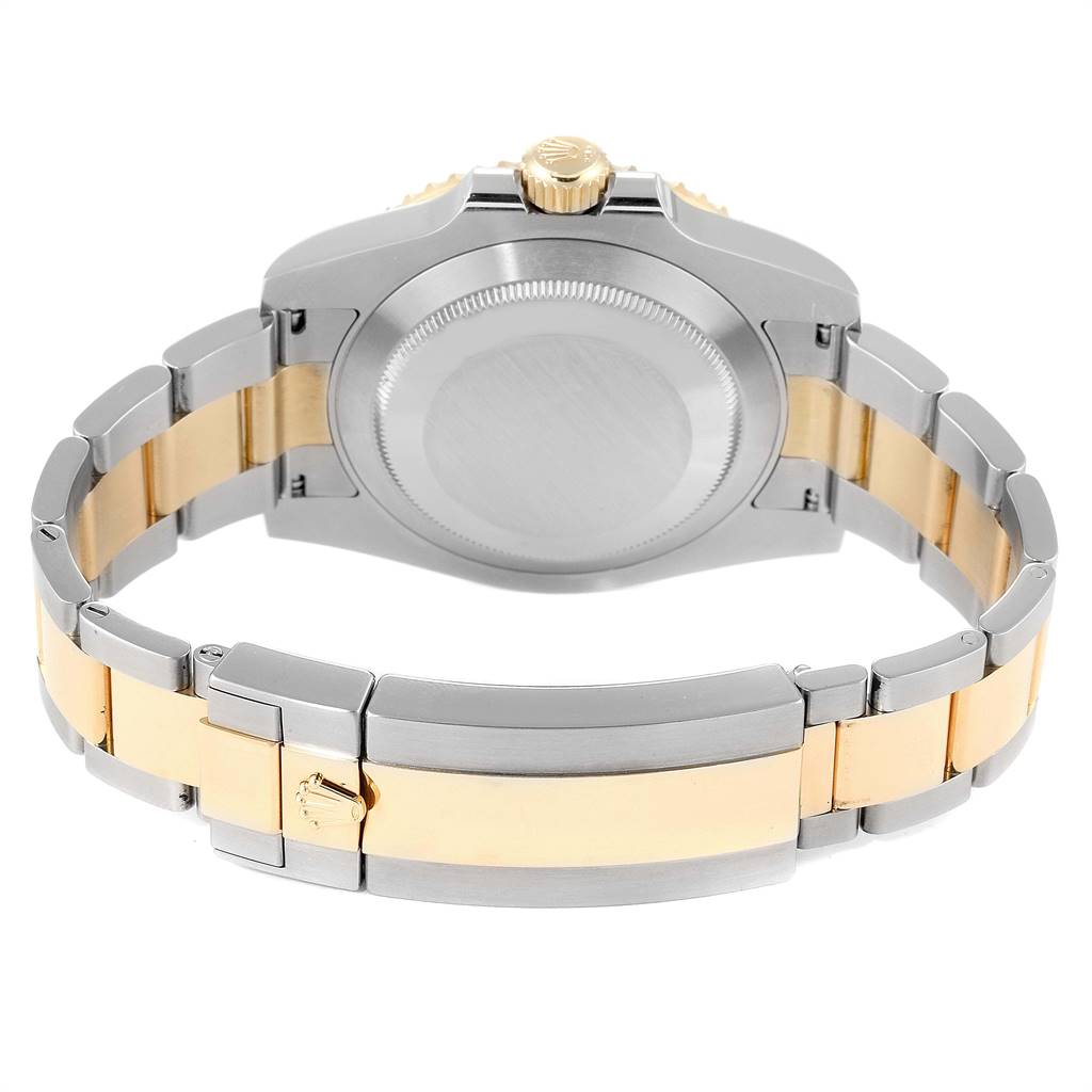 This image shows the back case and bracelet of a Rolex Submariner 116613 Men
s Steel and Gold (two tone) Blue Dial 116613 Men
s Steel and Gold (two tone) Blue Dial watch, focusing on the clasp and crown.