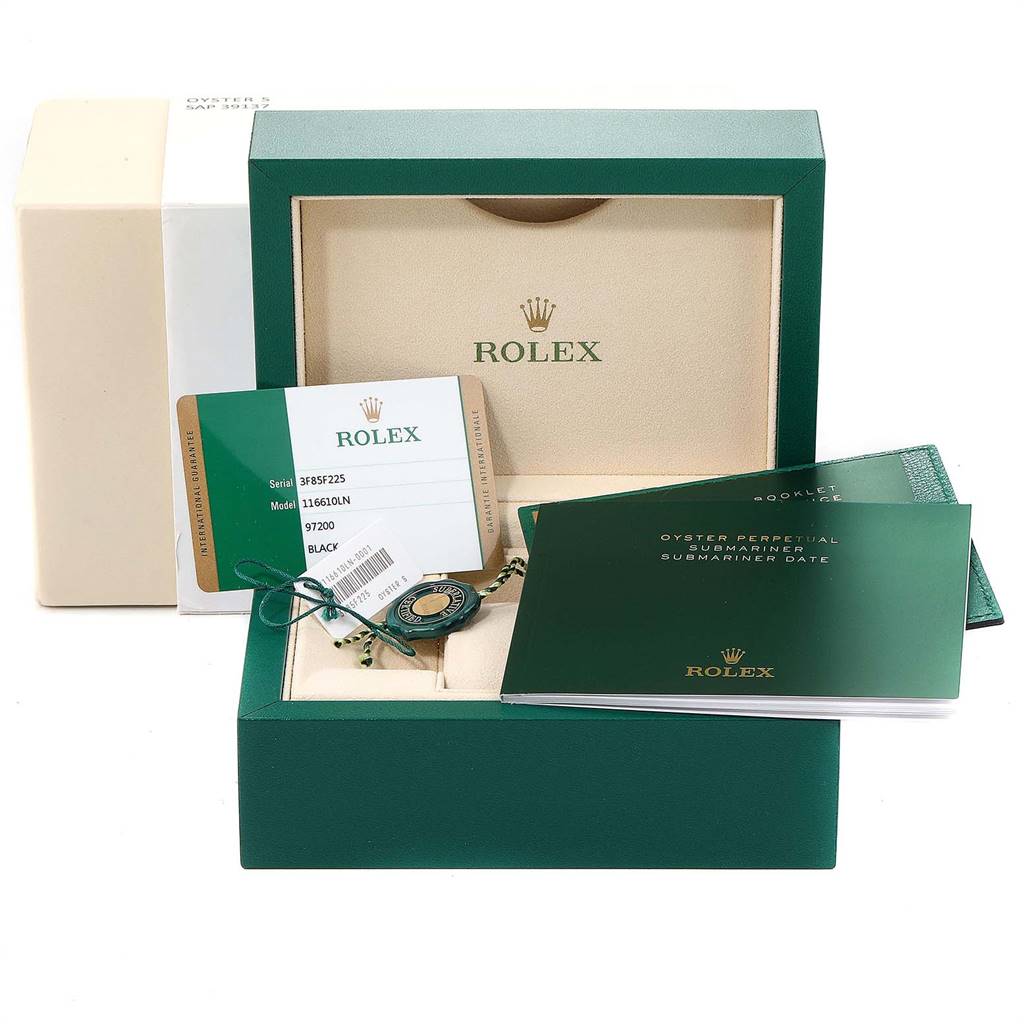 The image shows the box, warranty card, tag, and manuals for a Rolex Submariner 116610 Men
s Stainless Steel Black Dial 116610 Men
s Stainless Steel Black Dial watch from a front angle.