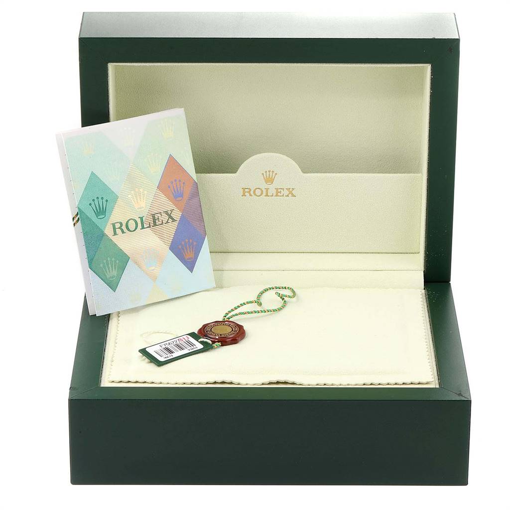 The image shows the packaging box, booklet, and a tag for a Rolex Submariner 16613 Men
s Steel and Gold (two tone) Blue Dial 16613 Men
s Steel and Gold (two tone) Blue Dial watch.