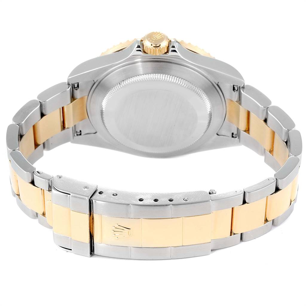 The image shows the back view of a Rolex Submariner 16613 Men
s Steel and Gold (two tone) Blue Dial 16613 Men
s Steel and Gold (two tone) Blue Dial watch, highlighting its stainless steel and gold bracelet and case back.