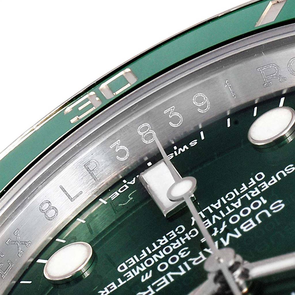 This image shows a close-up of a Rolex Submariner 116610LV Men
s Stainless Steel Green Dial 116610LV Men
s Stainless Steel Green Dial model focusing on the dial, bezel, and part of the text on the watch face.