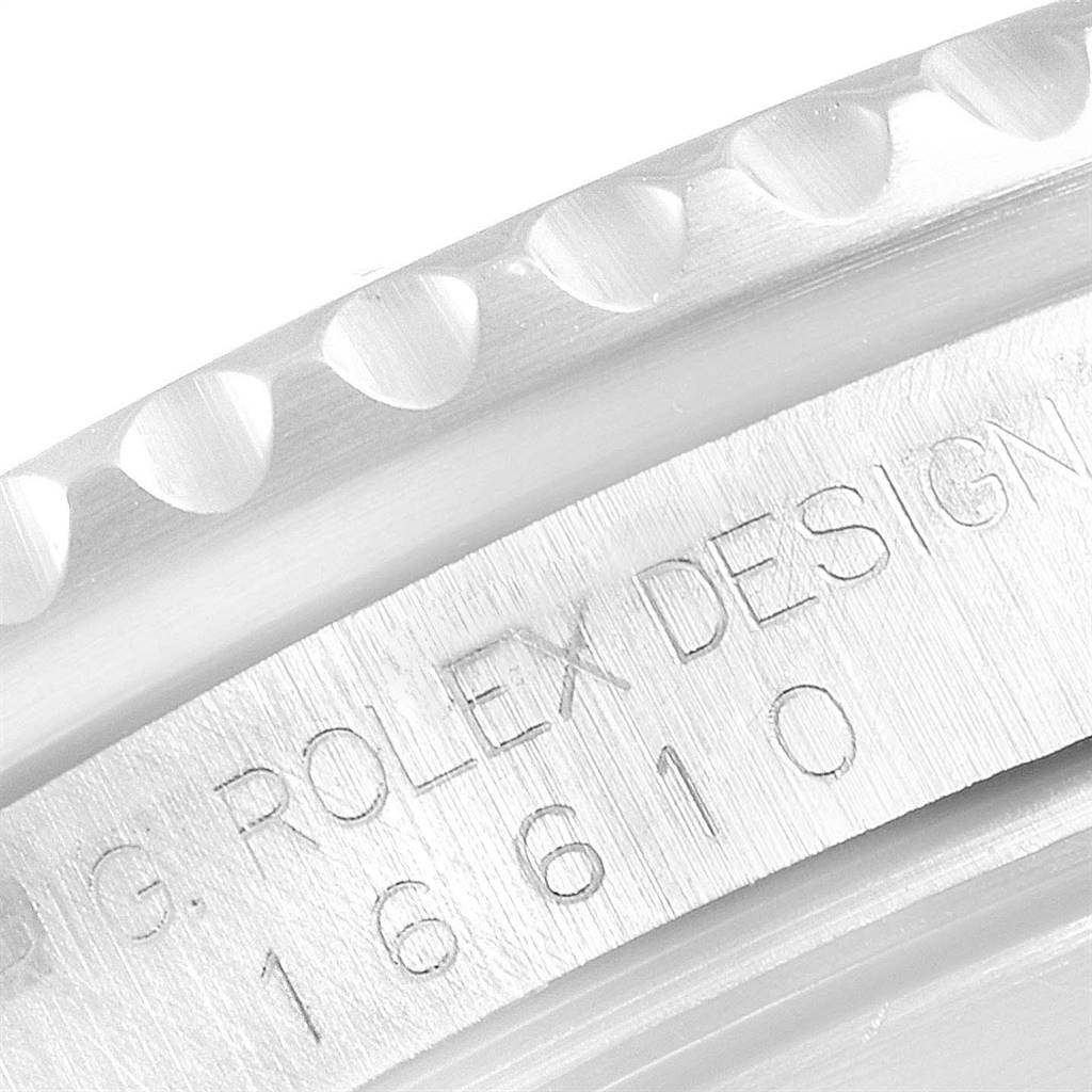 This image shows a close-up of the side profile of a Rolex Submariner 16610 Men's Stainless Steel Black Dial 16610 Men's Stainless Steel Black Dial model, highlighting the engraved model number.