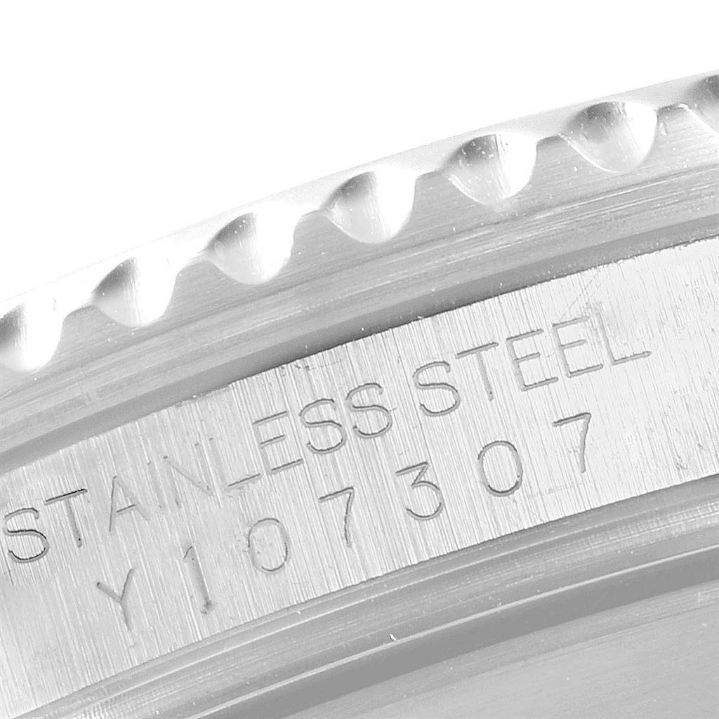 This close-up image shows the engraved serial number and "Stainless Steel" text on the case side of a Rolex Submariner 16610 Men's Stainless Steel Black Dial 16610 Men's Stainless Steel Black Dial watch.