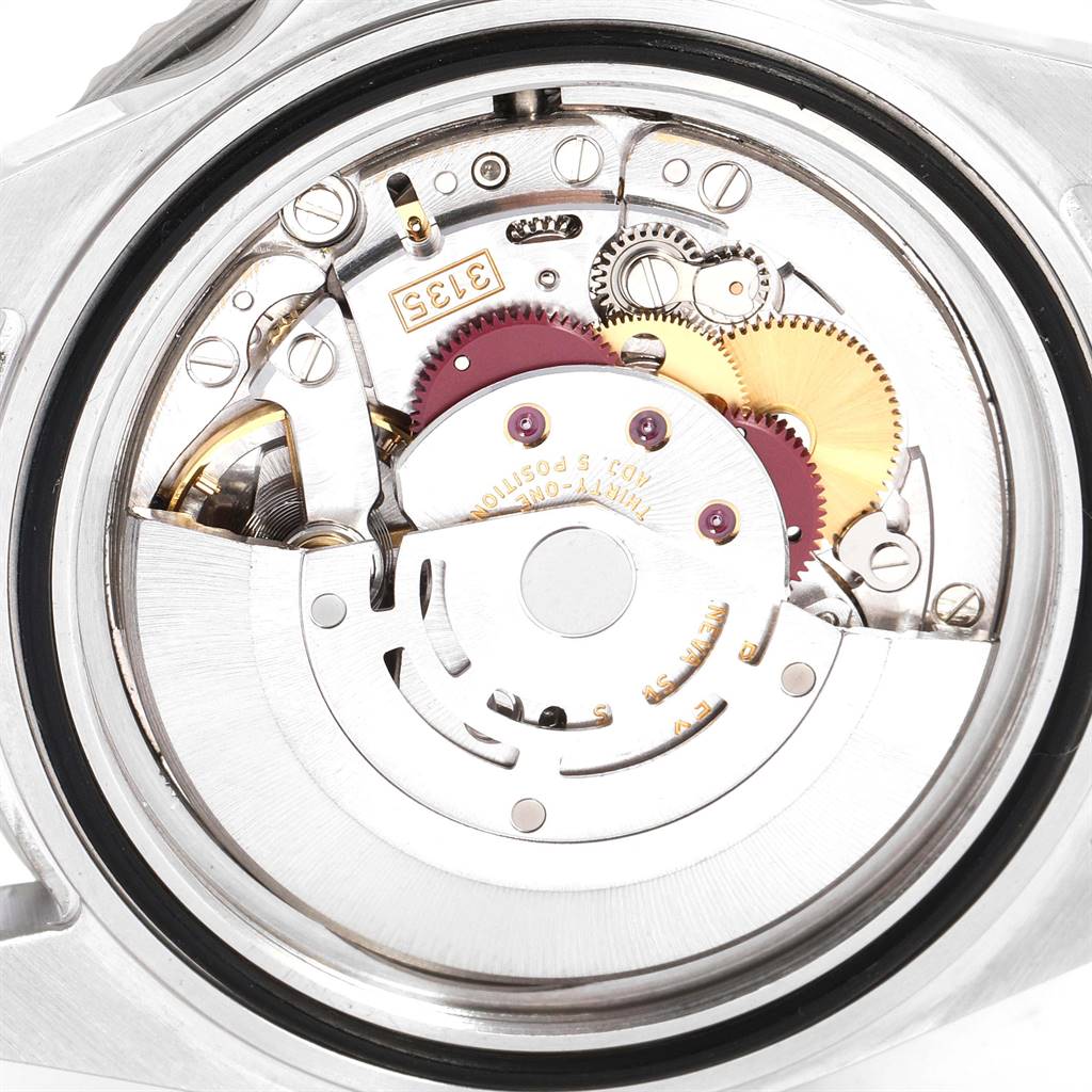 The image shows the internal mechanical movement of a Rolex Submariner 16610 Men's Stainless Steel Black Dial 16610 Men's Stainless Steel Black Dial watch from a back angle.