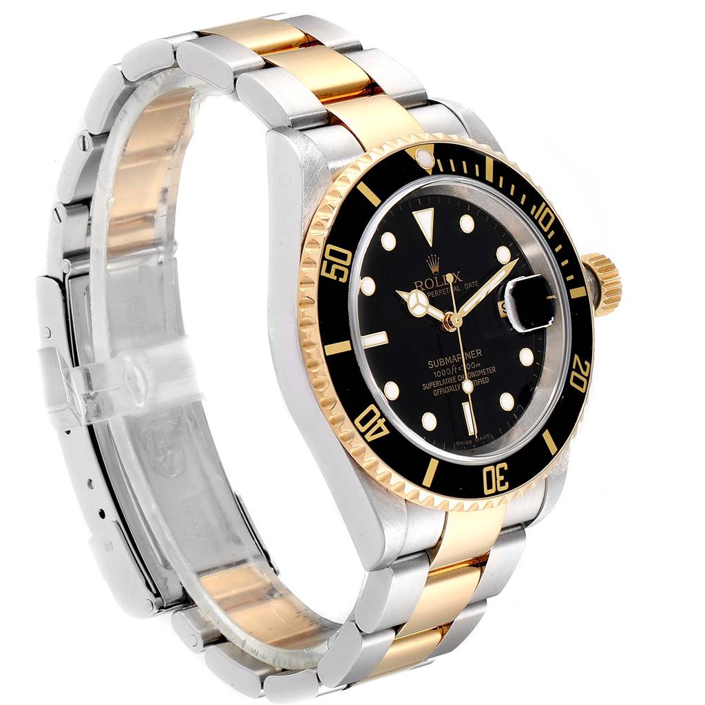 The image shows a Rolex Submariner 16613 Men
s Steel and Gold (two tone) Black Dial 16613 Men
s Steel and Gold (two tone) Black Dial watch from a three-quarter angle, highlighting its gold and silver bracelet, black bezel, and dial.