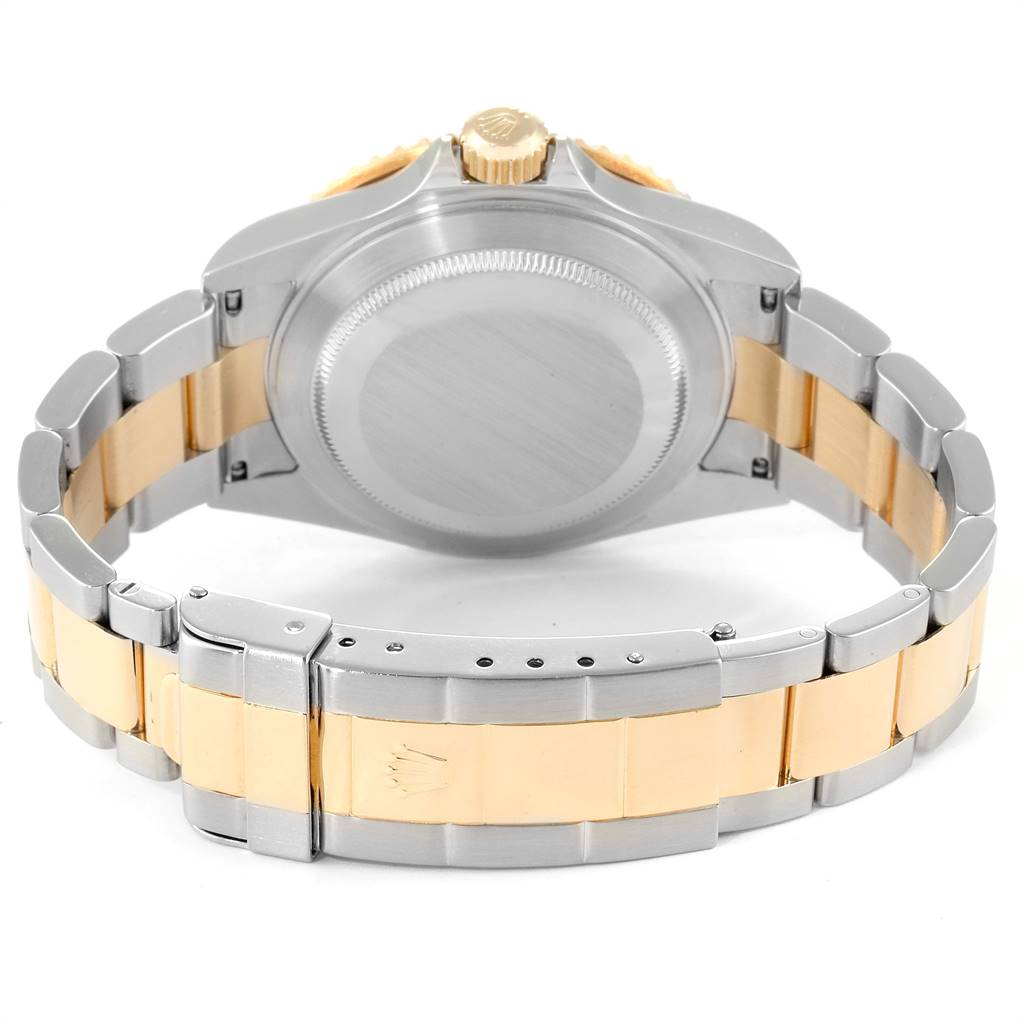 This image shows the back side of a Rolex Submariner 16613 Men
s Steel and Gold (two tone) Black Dial 16613 Men
s Steel and Gold (two tone) Black Dial watch, featuring the case and two-tone bracelet.