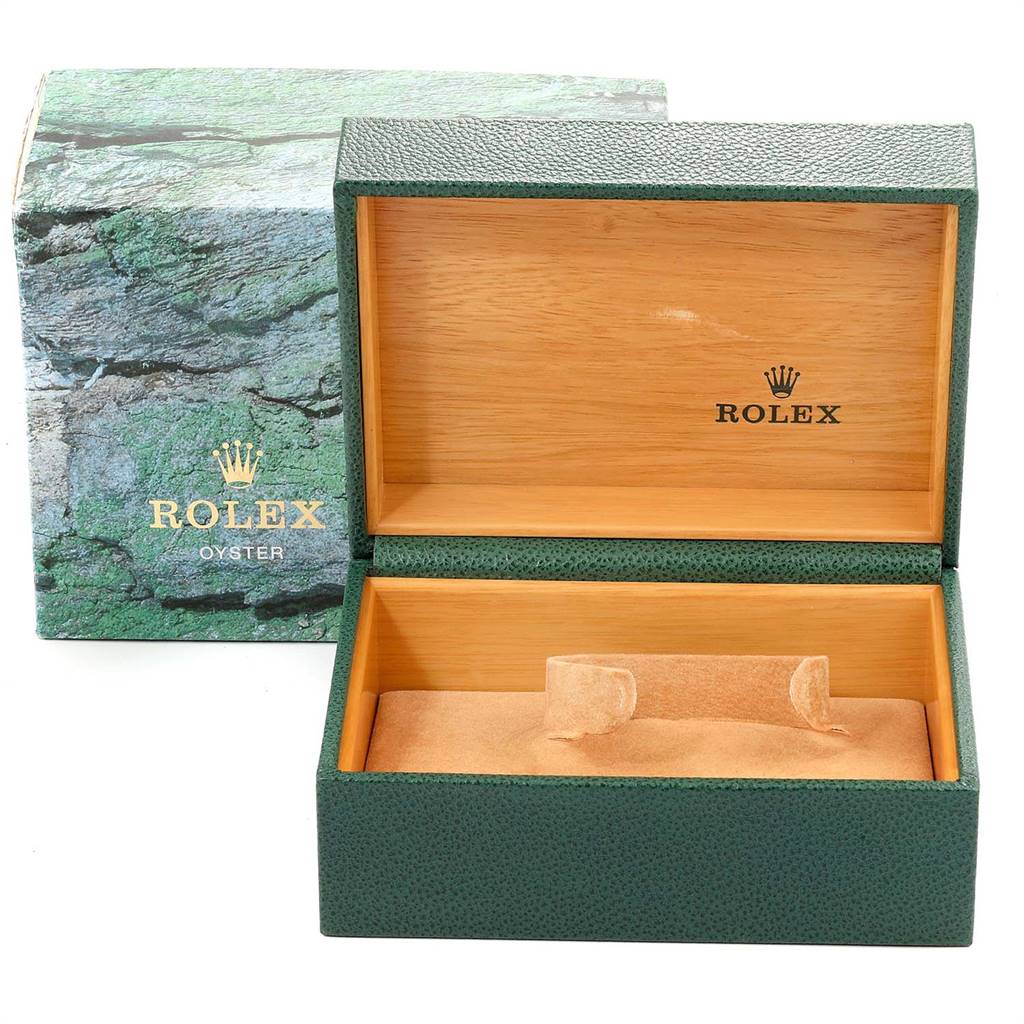The image shows an open green and wooden Rolex Submariner 16613 Men
s Steel and Gold (two tone) Champagne Dial 16613 Men
s Steel and Gold (two tone) Champagne Dial watch box with the outer green box in the background.