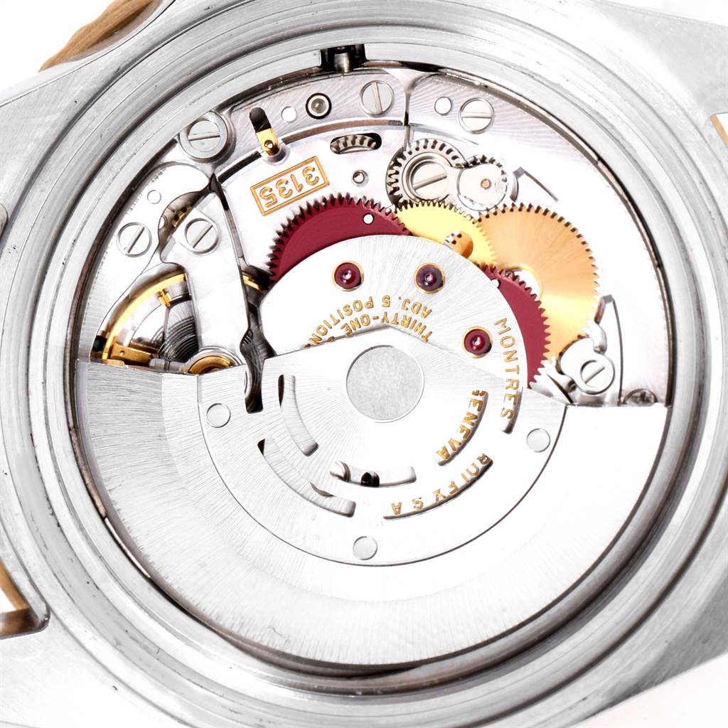This image shows the inner movement mechanism of a Rolex Submariner 16613 Men
s Steel and Gold (two tone) Champagne Dial 16613 Men
s Steel and Gold (two tone) Champagne Dial watch, viewed from the back.