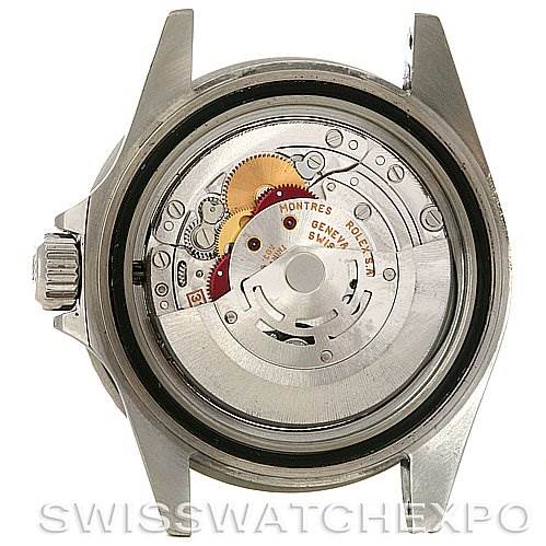 This image shows the back view of the Rolex Submariner 16610 Men's Stainless Steel Black Dial 16610 Men's Stainless Steel Black Dial watch, revealing its internal movement and gears.