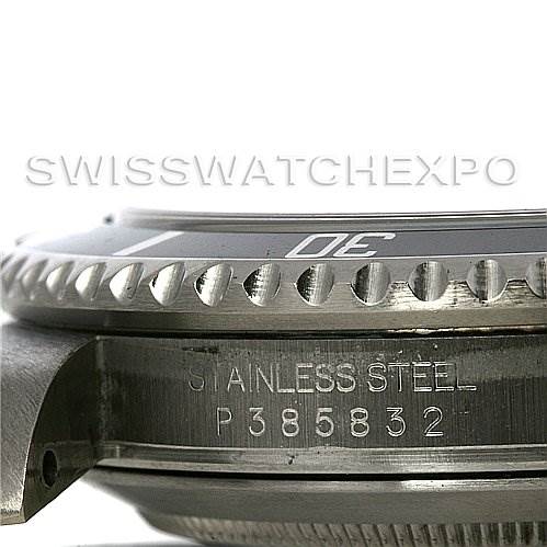 This image shows a close-up, side view of the Rolex Submariner 16610 Men's Stainless Steel Black Dial 16610 Men's Stainless Steel Black Dial watch case, highlighting the bezel and serial number engraving.