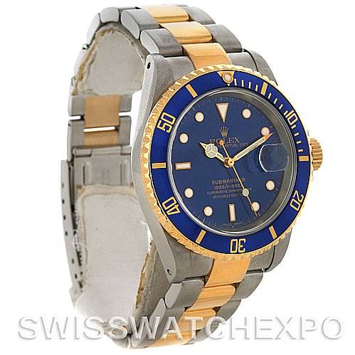 The image shows a Rolex Submariner 16613 Men's Yellow Gold Blue Dial 16613 Men's Yellow Gold Blue Dial watch from a three-quarter angle, highlighting its blue dial, bezel, and two-tone metal bracelet.