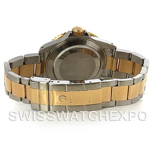 The image shows the back view of a Rolex Submariner 16613 Men's Yellow Gold Blue Dial 16613 Men's Yellow Gold Blue Dial watch, highlighting the case back, crown, and two-tone bracelet.
