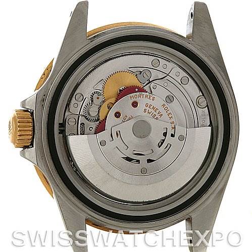 This image shows the back view of a Rolex Submariner 16613 Men's Yellow Gold Blue Dial 16613 Men's Yellow Gold Blue Dial model, exposing the intricate mechanics and movement inside the watch case.