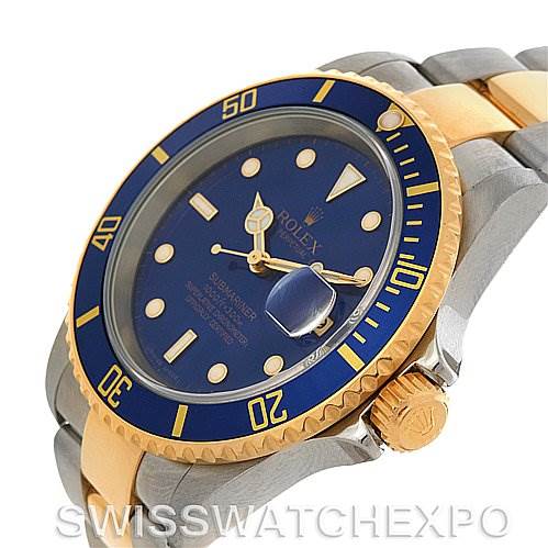 This image shows the Rolex Submariner 16613 Men's Yellow Gold Blue Dial 16613 Men's Yellow Gold Blue Dial watch at an angle highlighting its face, bezel, crown, and part of its two-tone bracelet.