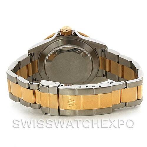 The image shows the back view of a Rolex Submariner 16613 Men's Yellow Gold Blue Dial 16613 Men's Yellow Gold Blue Dial watch, highlighting its case, bracelet, and clasp.