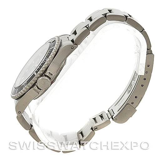 The image shows a side profile of a Rolex Submariner 14060M Men
s Stainless Steel Black Dial 14060M Men
s Stainless Steel Black Dial, focusing on the bracelet, clasp, and side case, including the crown.