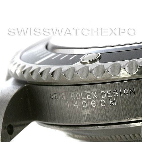 This close-up angle of a Rolex Submariner 14060M Men
s Stainless Steel Black Dial 14060M Men
s Stainless Steel Black Dial shows the side of the case, the bezel, and the model engraving "ORIG.ROLEX DESIGN 14060M".