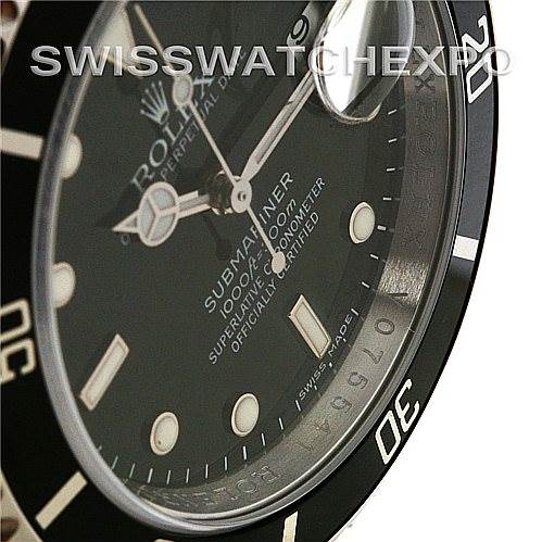 This is not a Ballon Bleu model by Cartier; it is a Rolex Submariner, showing the watch face and bezel at an angled close-up.