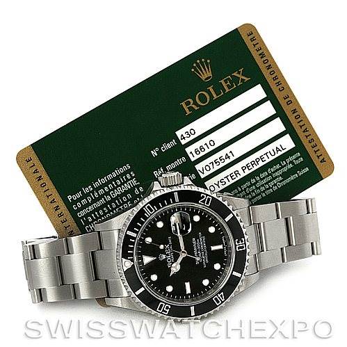The image shows a Rolex Oyster Perpetual watch and its certification card; no Cartier Ballon Bleu 16610 Women's Stainless Steel Black Dial 16610 Women's Stainless Steel Black Dial model watch is depicted.