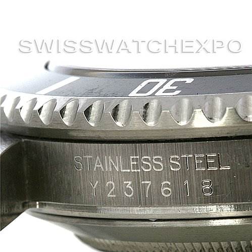 The image shows a close-up of the bezel, case, and serial number engraving of a Rolex Submariner 16610 Men's Stainless Steel Black Dial 16610 Men's Stainless Steel Black Dial watch.