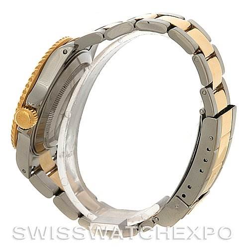 This image shows a side view of a Rolex Submariner 16613 Men's Yellow Gold Grey Dial 16613 Men's Yellow Gold Grey Dial, highlighting the gold bezel, crown, and two-tone metal bracelet.