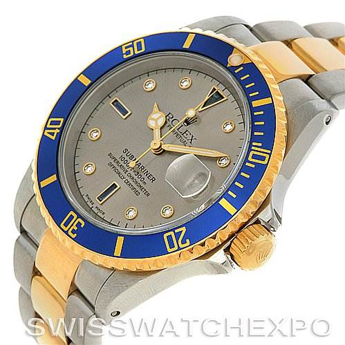 This image shows an angled view of a Rolex Submariner 16613 Men's Yellow Gold Grey Dial 16613 Men's Yellow Gold Grey Dial watch, highlighting its two-tone bezel, dial, and bracelet.