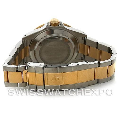 This image shows the back case, crown, and bracelet of a Rolex Submariner 16613 Men's Yellow Gold Grey Dial 16613 Men's Yellow Gold Grey Dial watch from a rear angle.