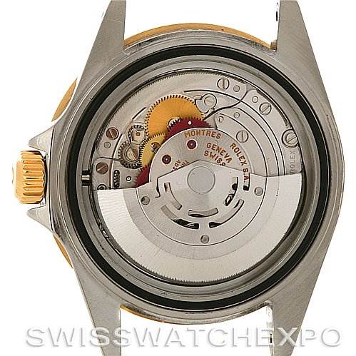 This image shows the movement mechanism of a Rolex Submariner 16613 Men's Yellow Gold Grey Dial 16613 Men's Yellow Gold Grey Dial watch, viewed from the back with the case and gears visible.