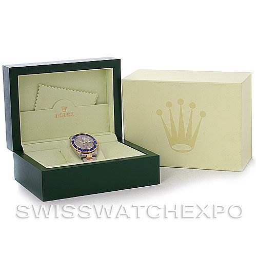 The image shows the Rolex Submariner 16613 Men's Yellow Gold Grey Dial 16613 Men's Yellow Gold Grey Dial watch in its open green box, with the outer box and polishing cloth visible.