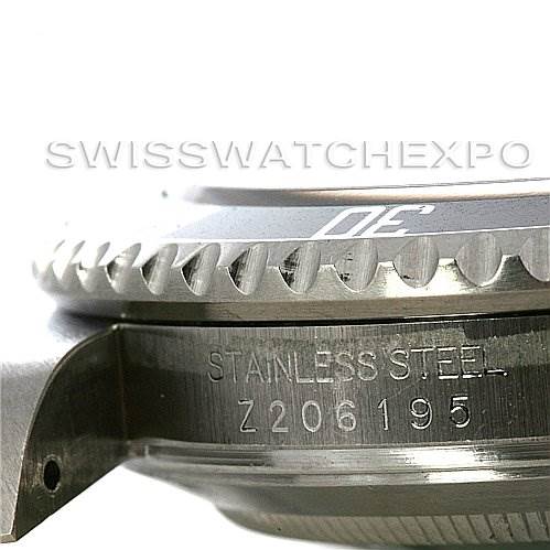 The image shows a close-up side view of the bezel and case, along with the etched serial number of a Rolex Submariner 16610 Men
s Stainless Steel Black Dial 16610 Men
s Stainless Steel Black Dial watch.