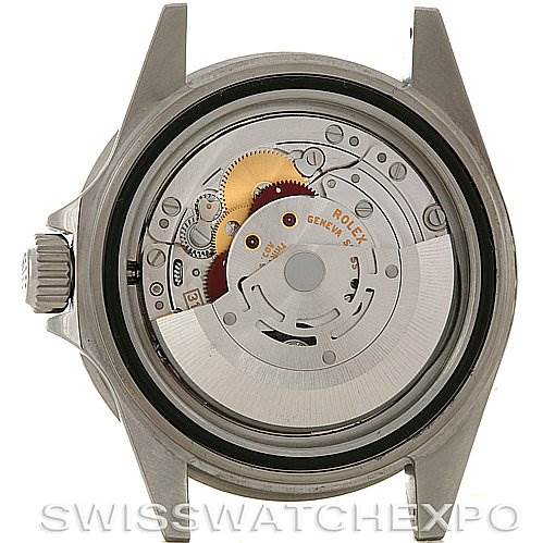 The image shows the case back removed from a Rolex Submariner 16610 Men
s Stainless Steel Black Dial 16610 Men
s Stainless Steel Black Dial watch, exposing its movement and inner mechanical components.