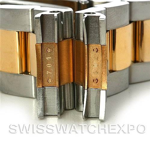 This image shows a close-up of the bracelet links of a Rolex Submariner 16613 Men's Steel and Gold (two tone) Blue Dial 16613 Men's Steel and Gold (two tone) Blue Dial watch.