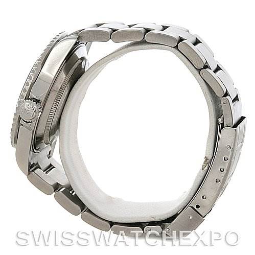 The image shows a side view of a Rolex Submariner 16610 Men
s Stainless Steel Black Dial 16610 Men
s Stainless Steel Black Dial watch, highlighting the bracelet, crown, and side of the case.