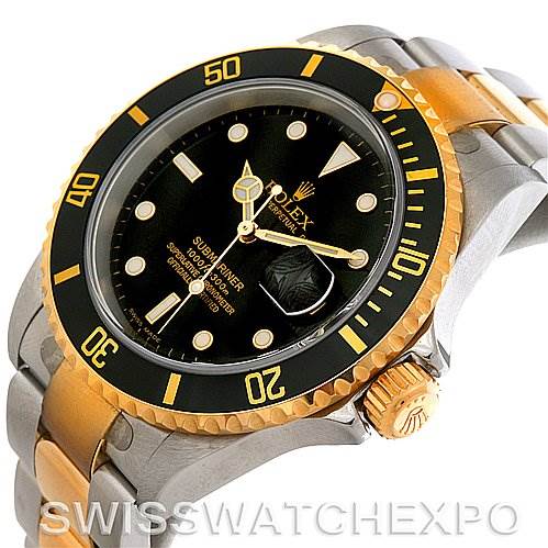 This image shows an angled view of the Rolex Submariner 16613T Men's Steel and Gold (two tone) Black Dial 16613T Men's Steel and Gold (two tone) Black Dial, highlighting the bezel, dial, crown, and part of the bracelet.